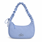 Bolsa deportiva versátil con correa ajustable Disponible en Azul Claro